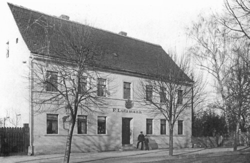 Friedrich Lutzmann&#039;s house in Dessau around 1898, with the coat of arms of the ducal master locksmith above the door.