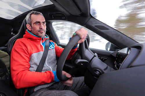 Test manager Florian Stahl on a test drive with the Porsche Taycan.
