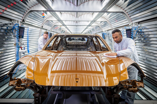Porsche quality control in the paint shop for the new Panamera in Madeira gold metallic.